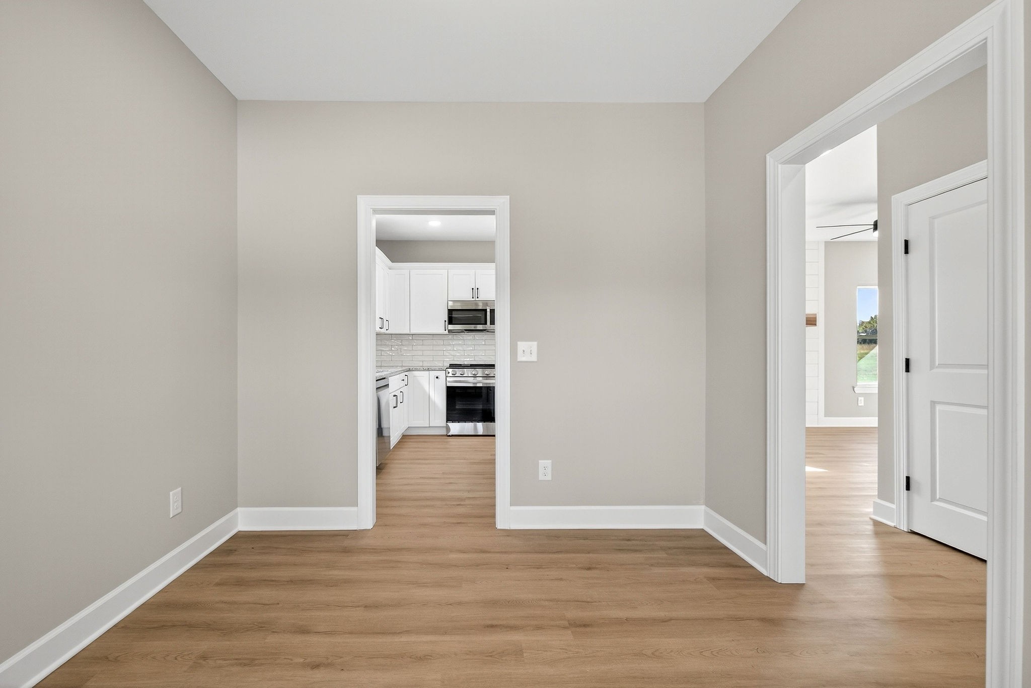 774 C Rody Road McMinnville, TN 37110 - Photo 13 of 40 a view of a kitchen with wooden floor and a sink