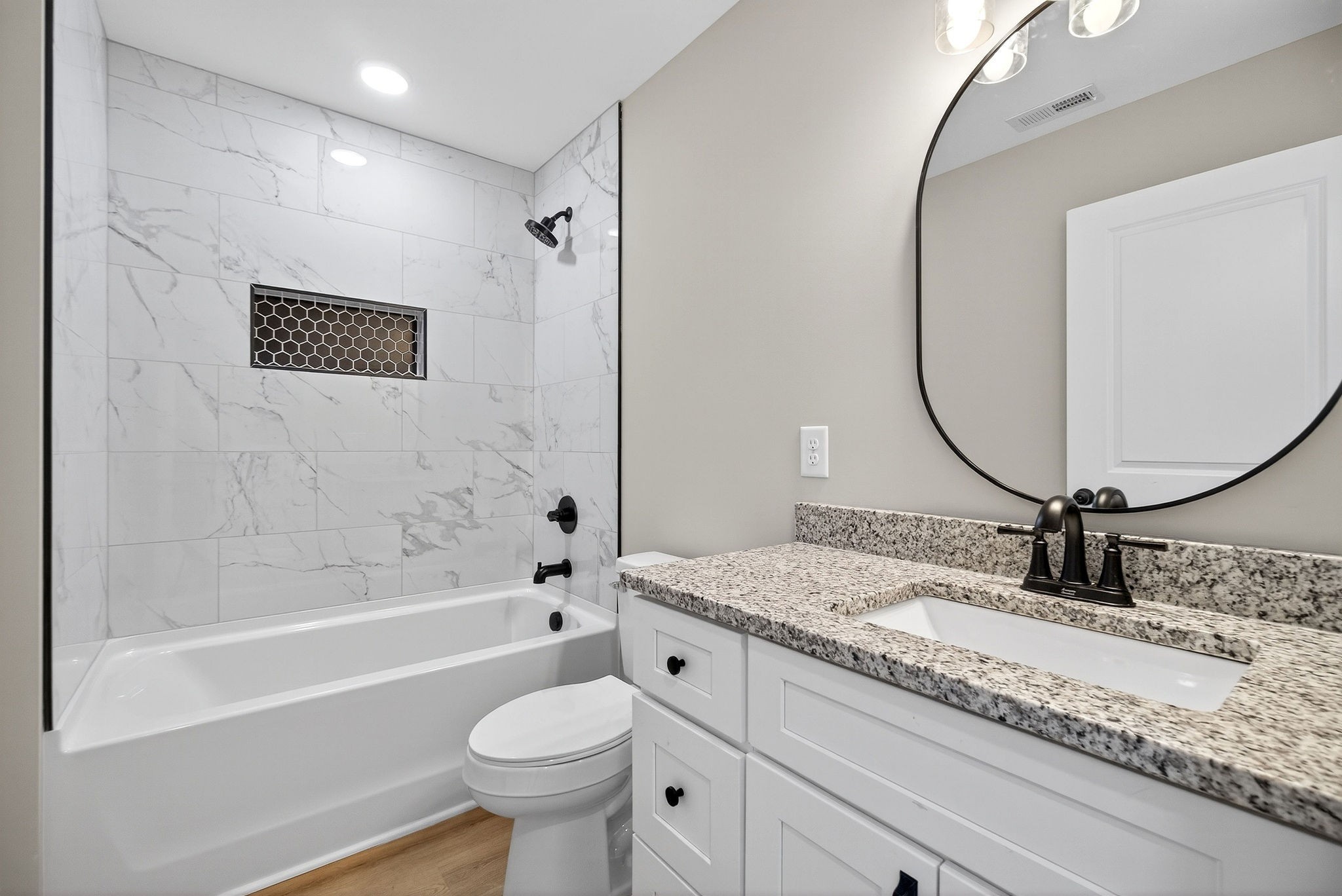 774 C Rody Road McMinnville, TN 37110 - Photo 24 of 40 a bathroom with a granite countertop sink mirror toilet and bathtub