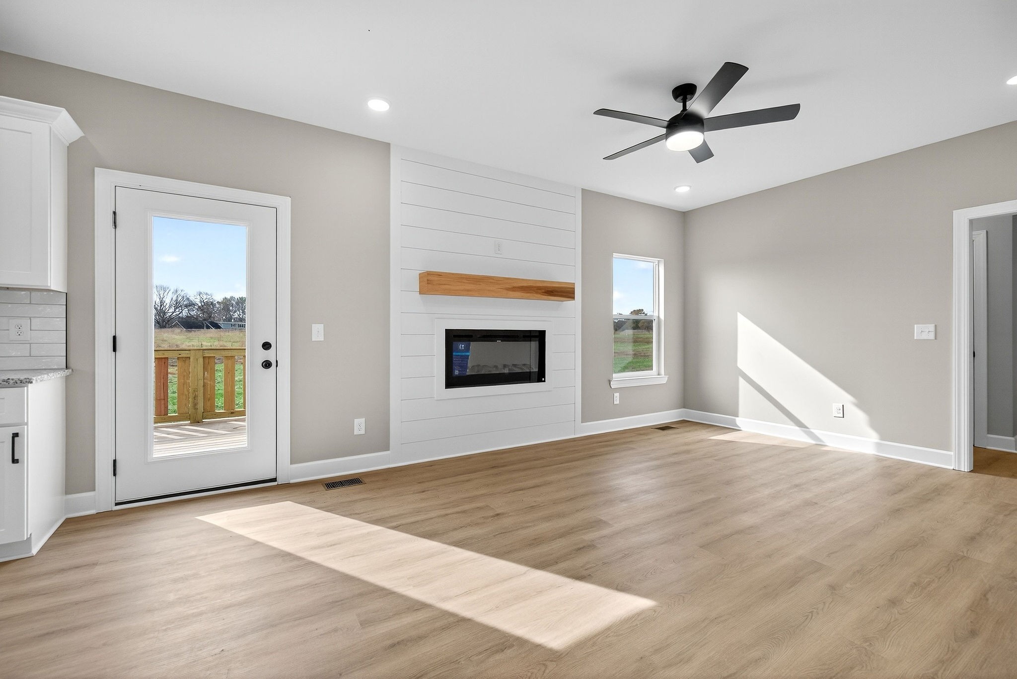 774 C Rody Road McMinnville, TN 37110 - Photo 3 of 40 a view of empty room with wooden floor and fan