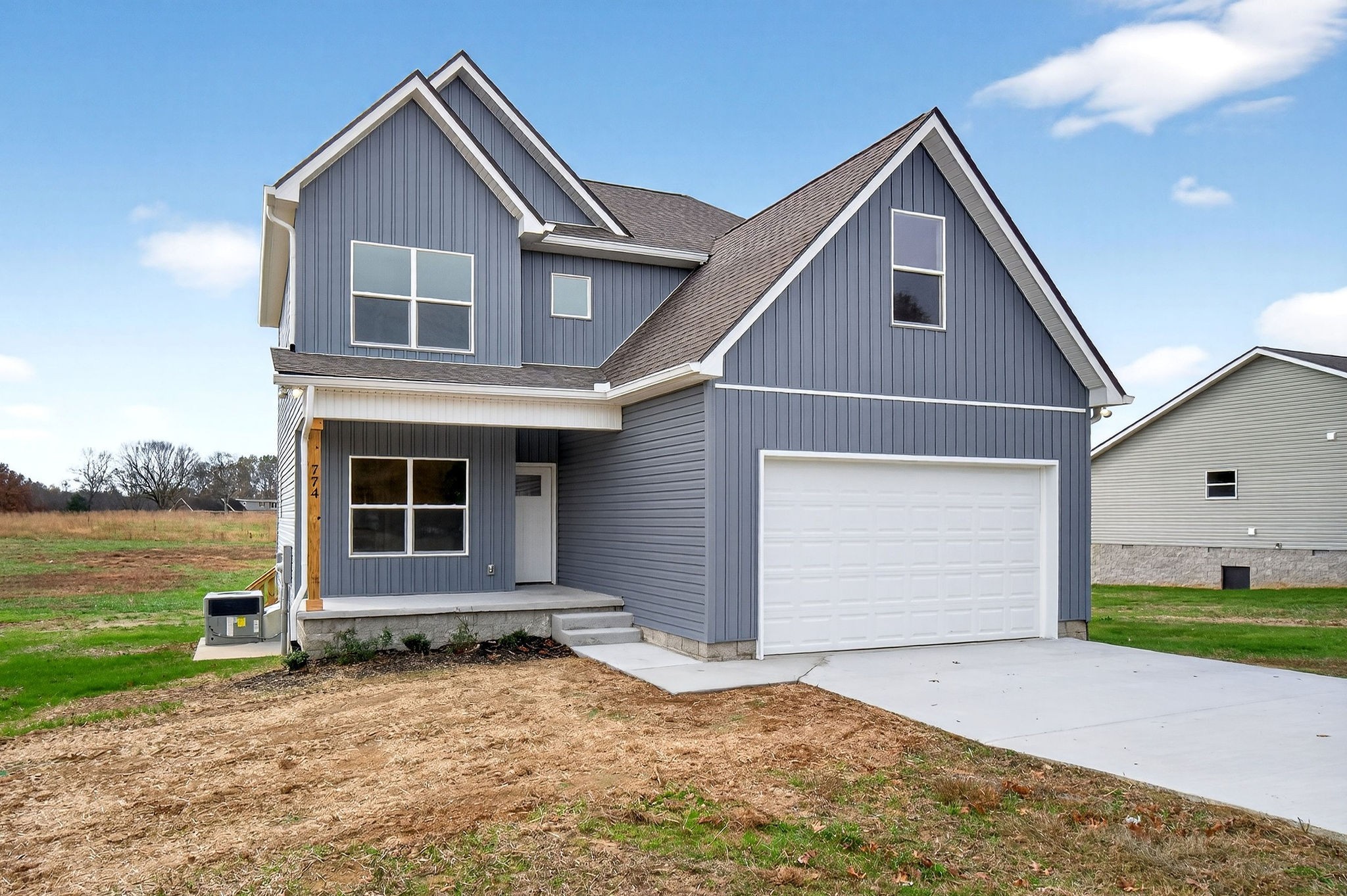 774 C Rody Road McMinnville, TN 37110 - Photo 34 of 40 a front view of a house with a yard and garage