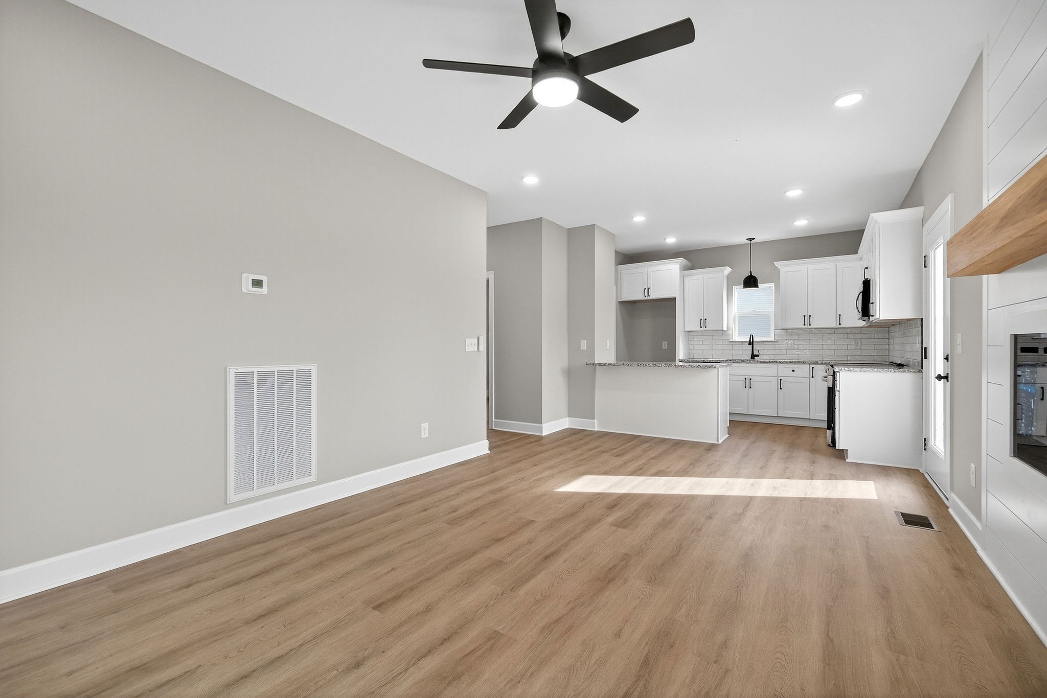 774 C Rody Road McMinnville, TN 37110 - Photo 5 of 40 a view of a kitchen with wooden floor and a sink