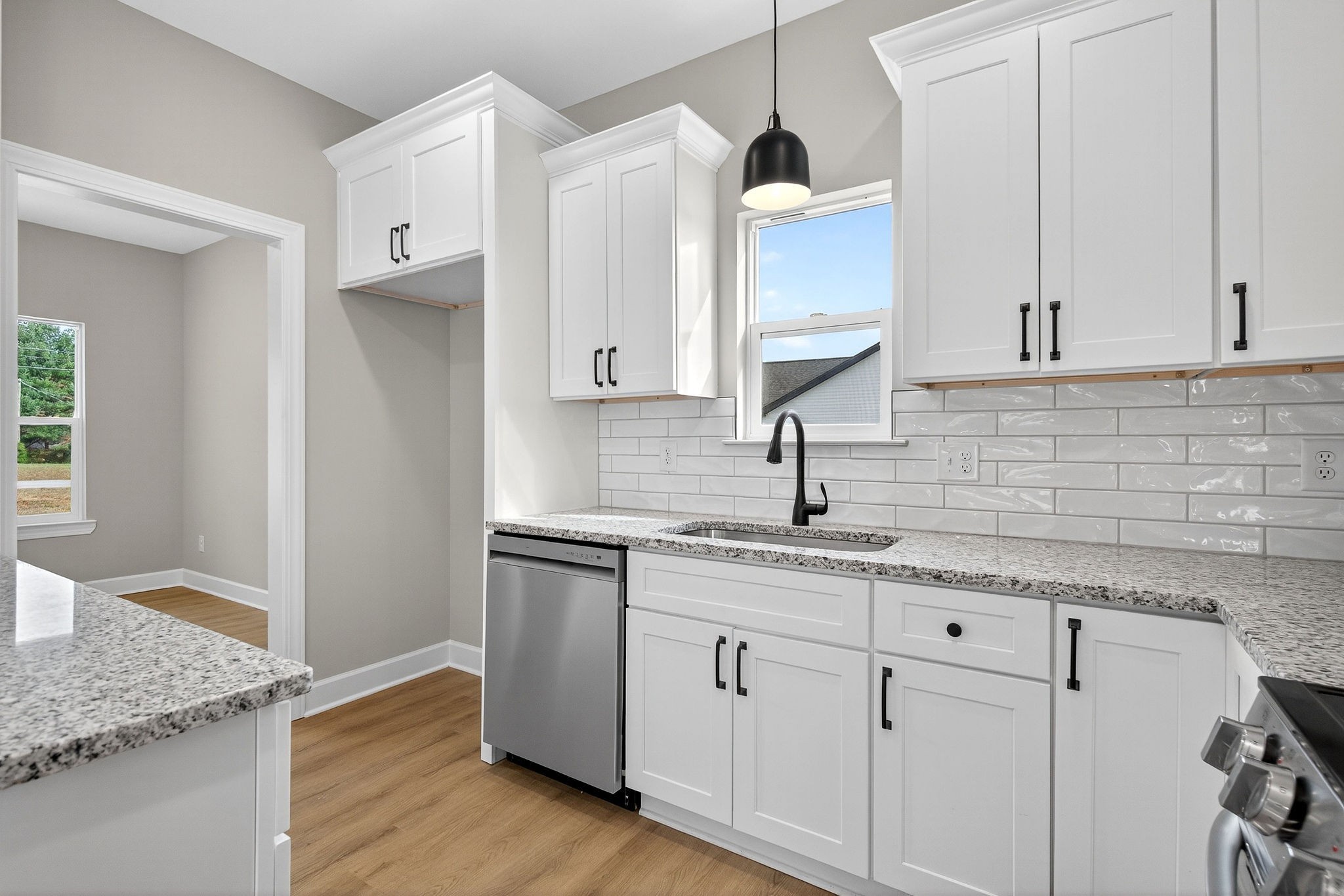 774 C Rody Road McMinnville, TN 37110 - Photo 8 of 40 a kitchen with granite countertop white cabinets and a sink