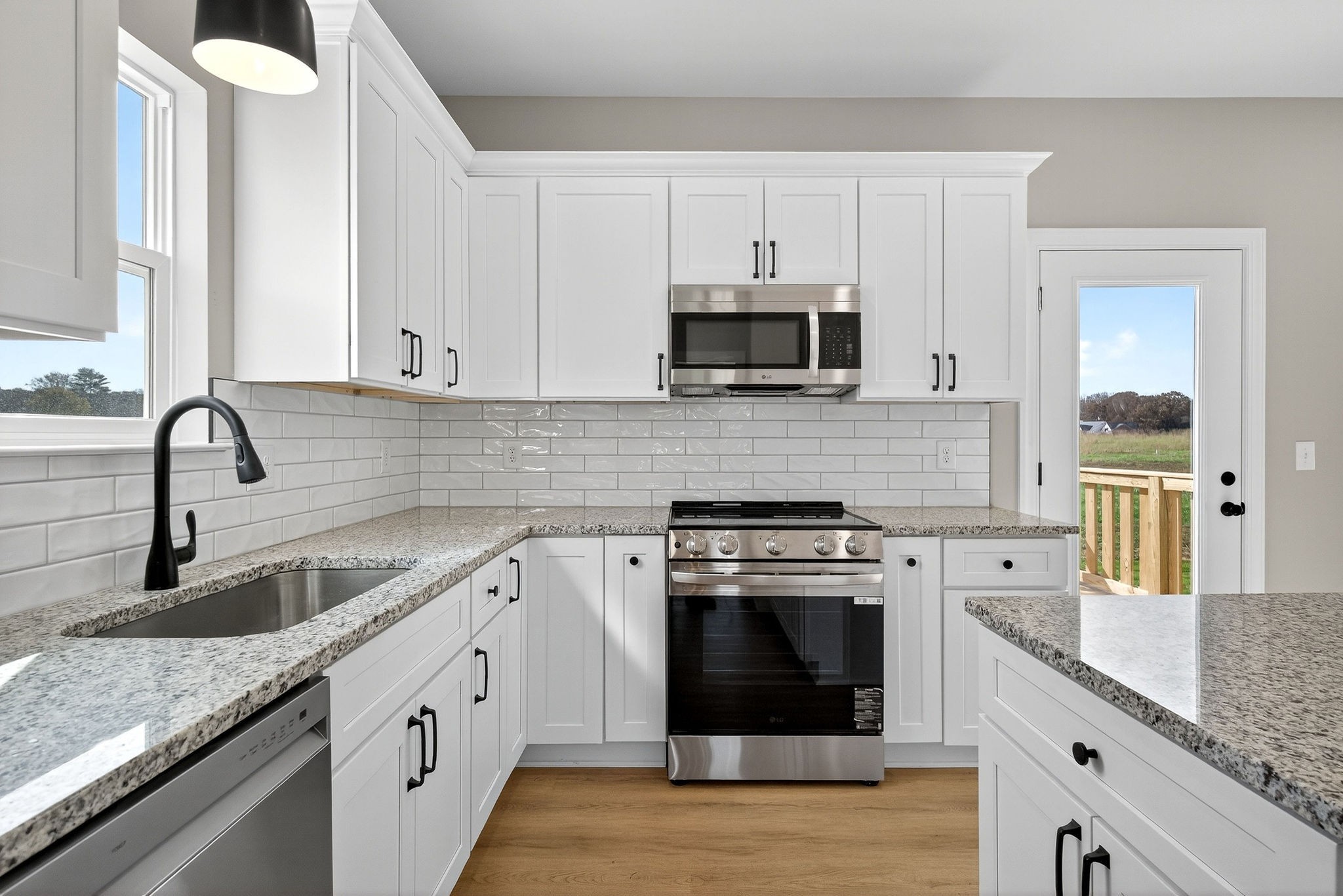 774 C Rody Road McMinnville, TN 37110 - Photo 10 of 40 a kitchen with stainless steel appliances granite countertop a sink stove and microwave