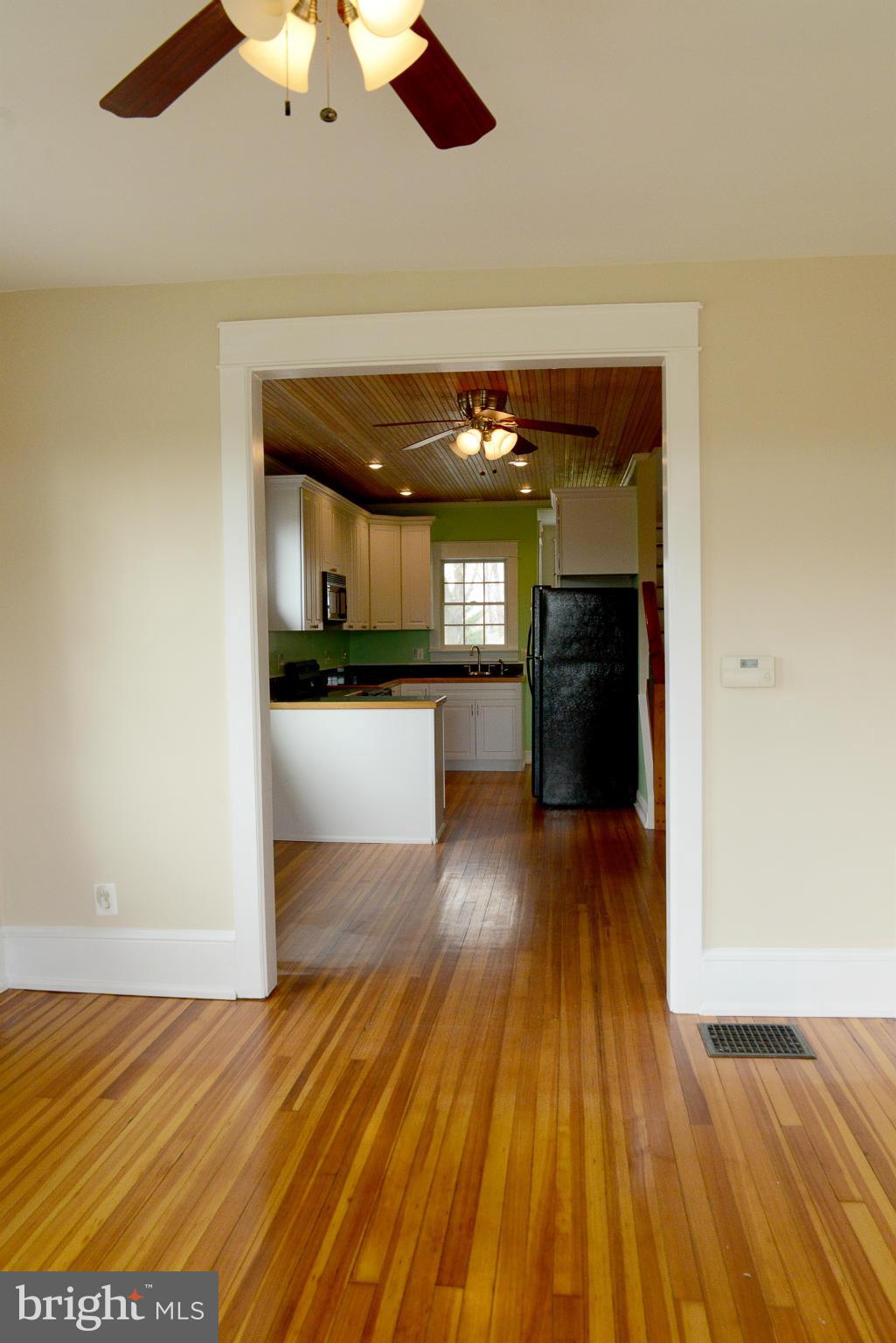 4912 Pleasant Grove Road Reisterstown, MD 21136 - Photo 12 of 26 LIVING ROOM TO DINING AREA