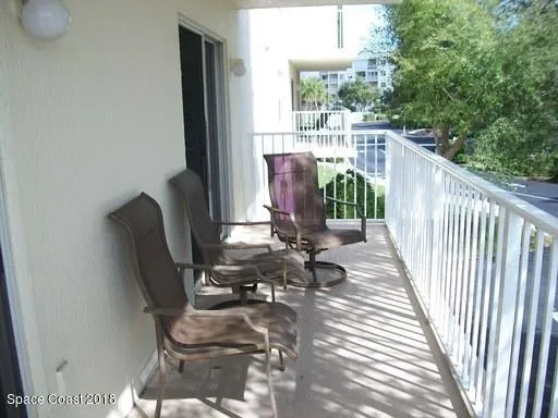 a view of balcony with wooden floor