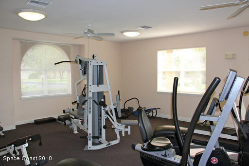 8911 Lake Drive, Unit 206 Cape Canaveral, FL 32920 - Photo 21 of 22 a view of a room with gym equipment