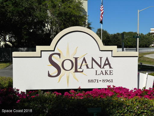 8911 Lake Drive, Unit 206 Cape Canaveral, FL 32920 - Photo 4 of 22 a sign that is on a pole