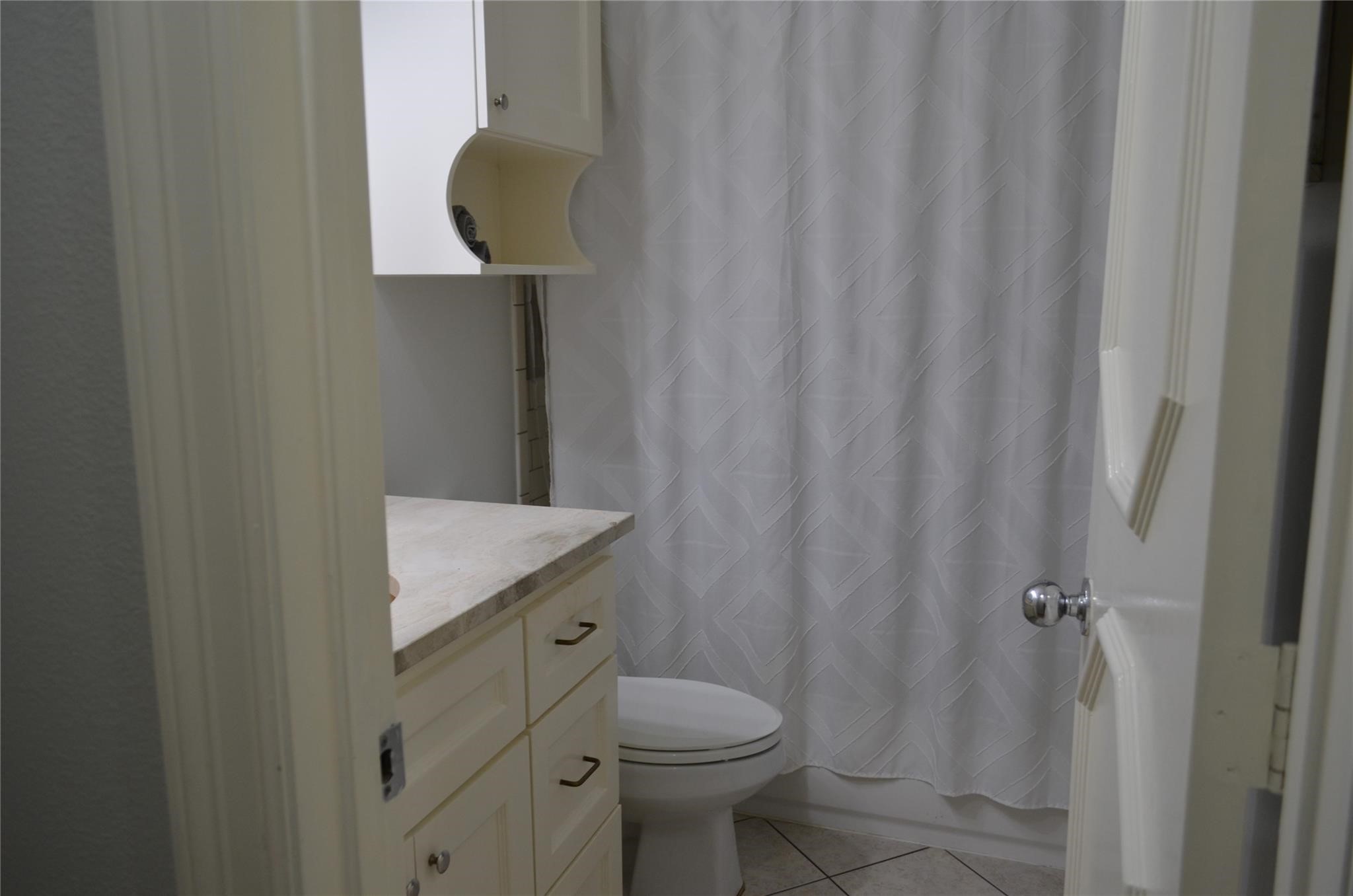 4731 High Point Lane Houston, TX 77053 - Photo 12 of 16 a bathroom with a toilet and a sink