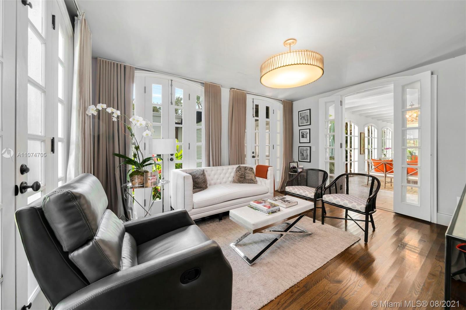 1000 Hardee Road Coral Gables, FL 33146 - Photo 12 of 26 a living room with furniture and a large window