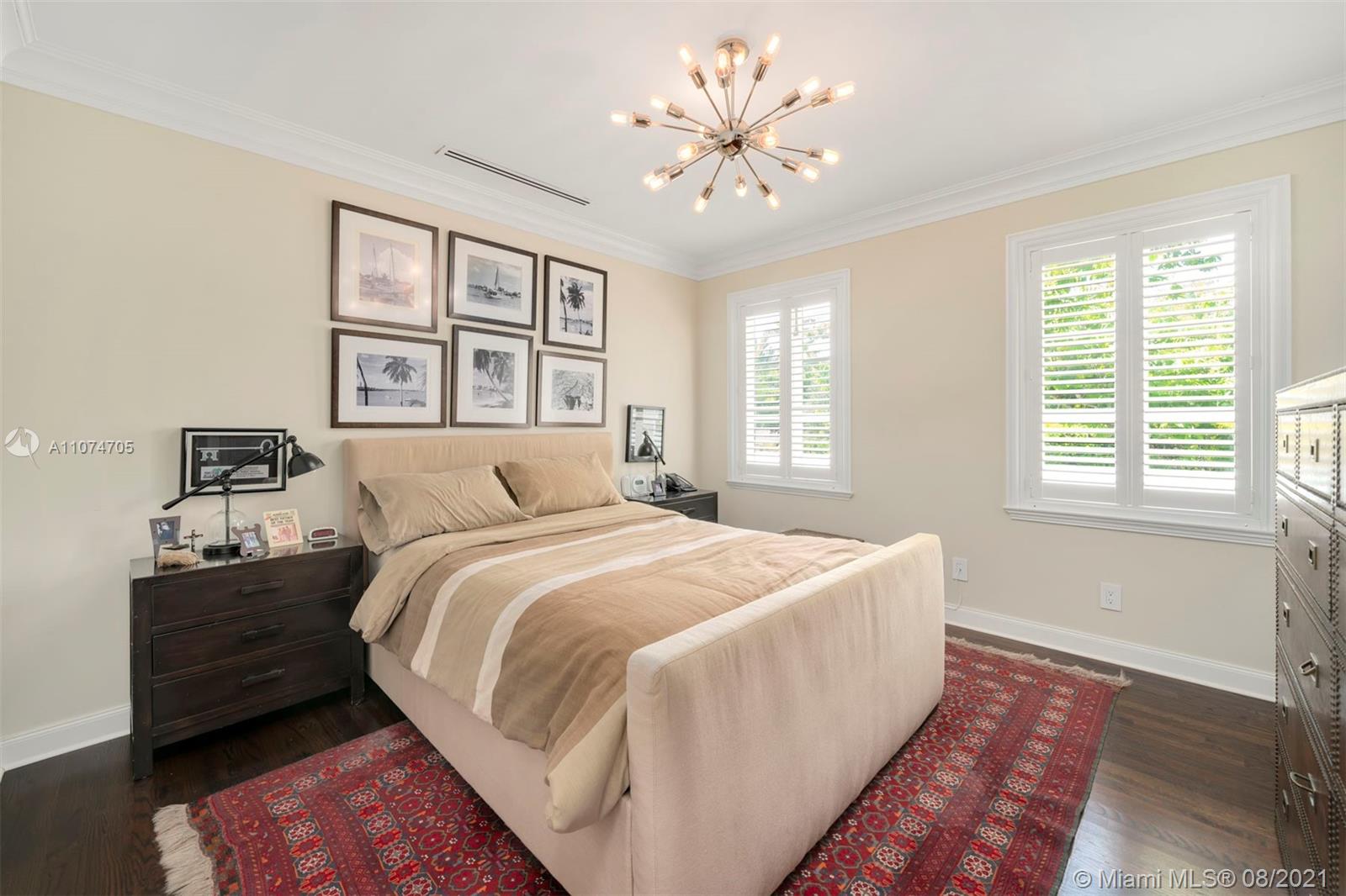 1000 Hardee Road Coral Gables, FL 33146 - Photo 19 of 26 a spacious bedroom with a bed and a window