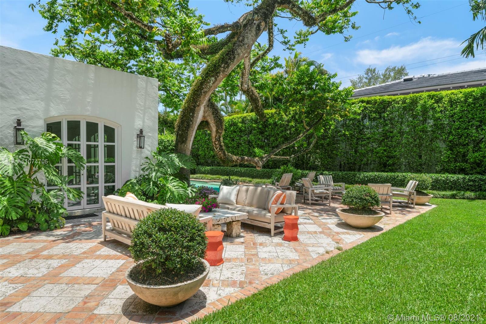 1000 Hardee Road Coral Gables, FL 33146 - Photo 21 of 26 a view of a backyard with sitting area and garden