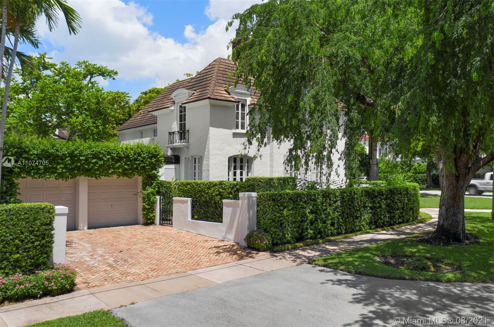 1000 Hardee Road Coral Gables, FL 33146 - Photo 26 of 26 a front view of a house with a yard and trees