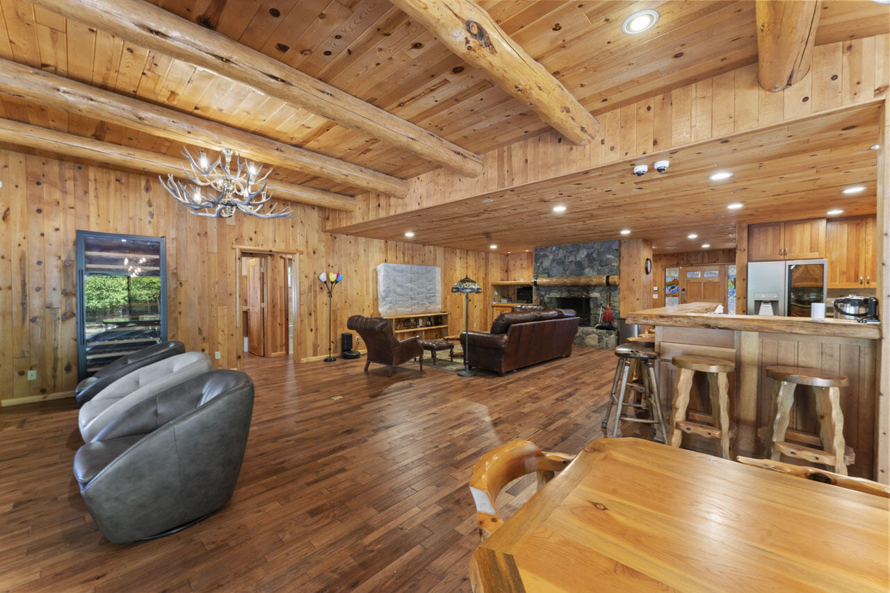 12214 Modoc Road White City, OR 97503 - Photo 24 of 47 a living room with lots of furniture and a chandelier