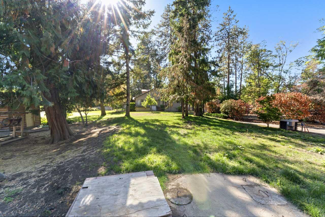 12214 Modoc Road White City, OR 97503 - Photo 33 of 47 a backyard of a house with lots of green space