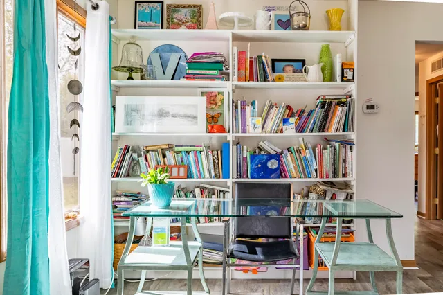 a shelf with books and a book shelf
