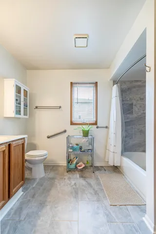 a bathroom with a toilet a sink and bathtub