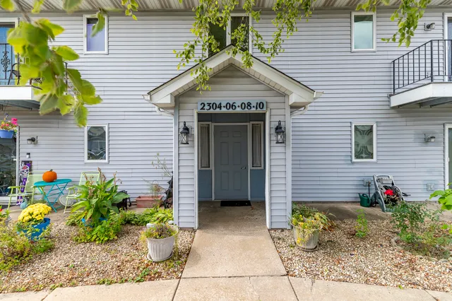 a front view of a house with a garage