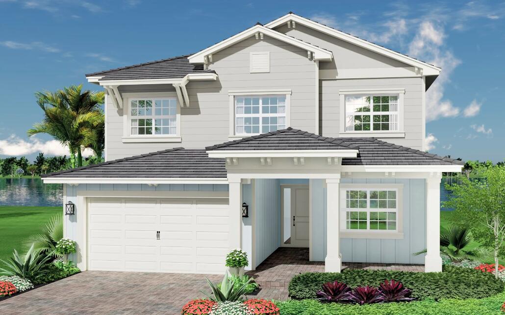 a view of a white house next to a yard