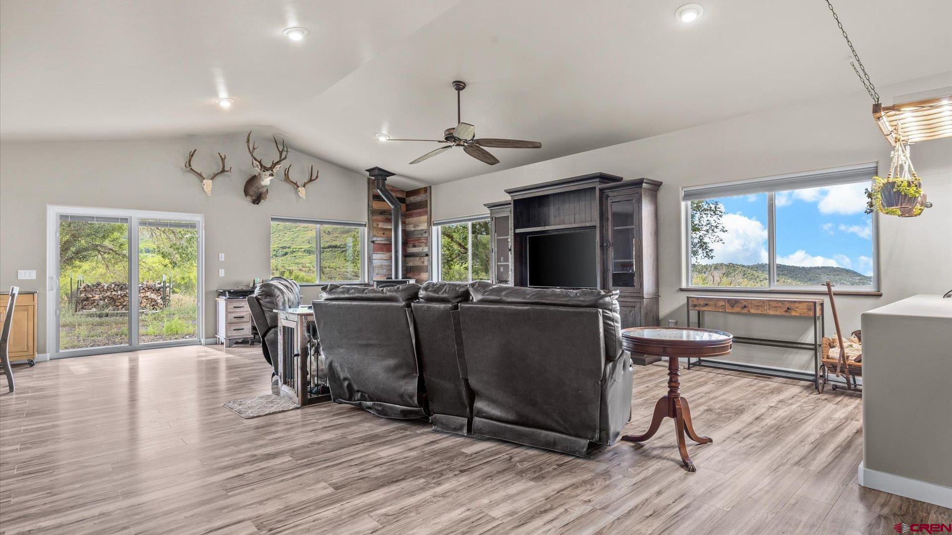 25571 Vail Road Cedaredge, CO 81413 - Photo 12 of 35 a view of a livingroom with furniture window and wooden floor