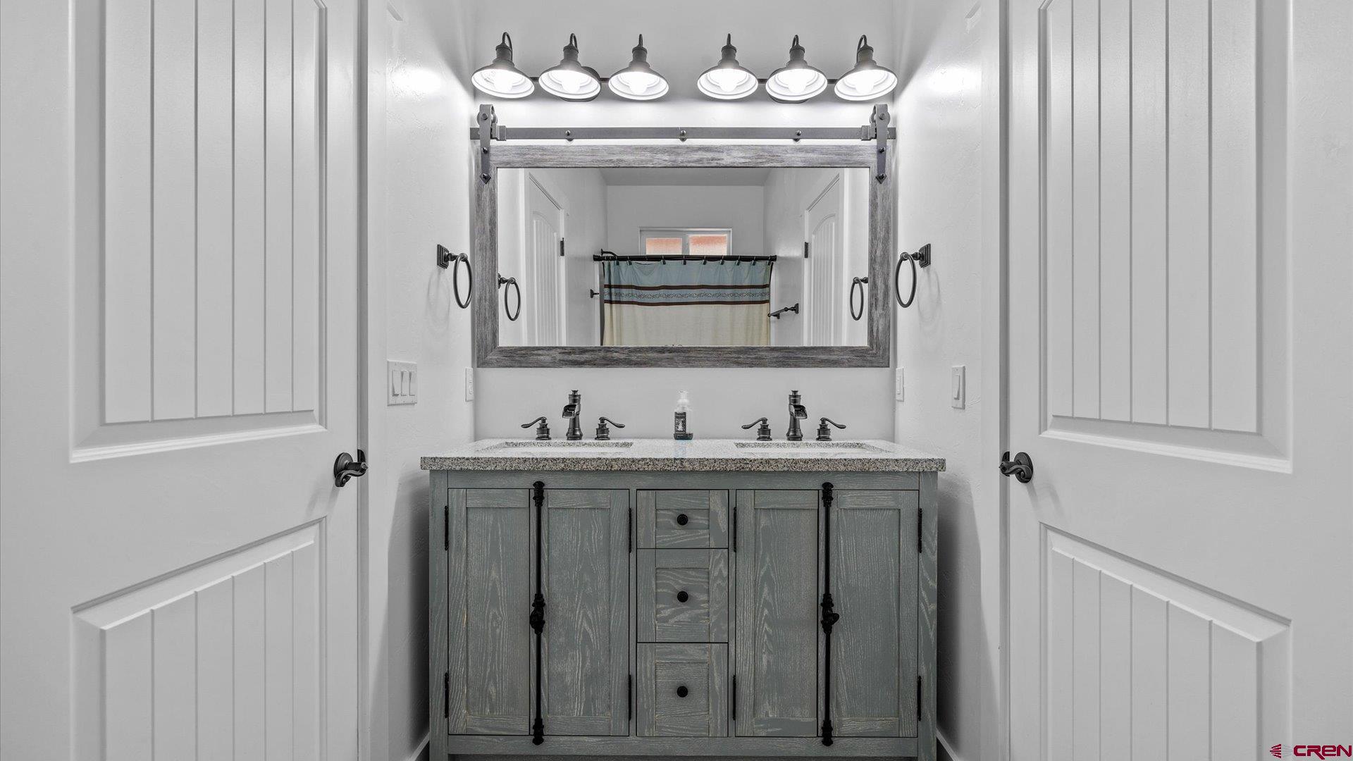 25571 Vail Road Cedaredge, CO 81413 - Photo 20 of 35 a bathroom with a sink and a mirror