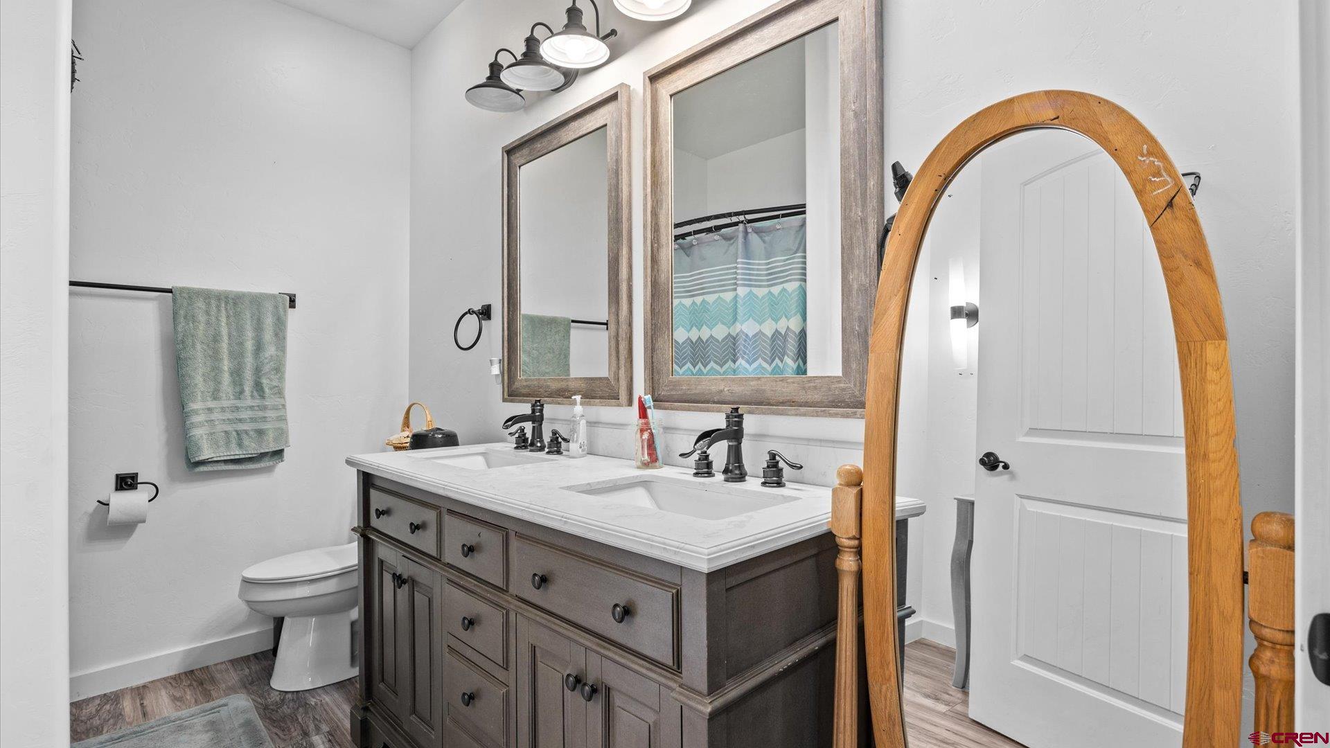 25571 Vail Road Cedaredge, CO 81413 - Photo 25 of 35 a bathroom with a sink and a mirror