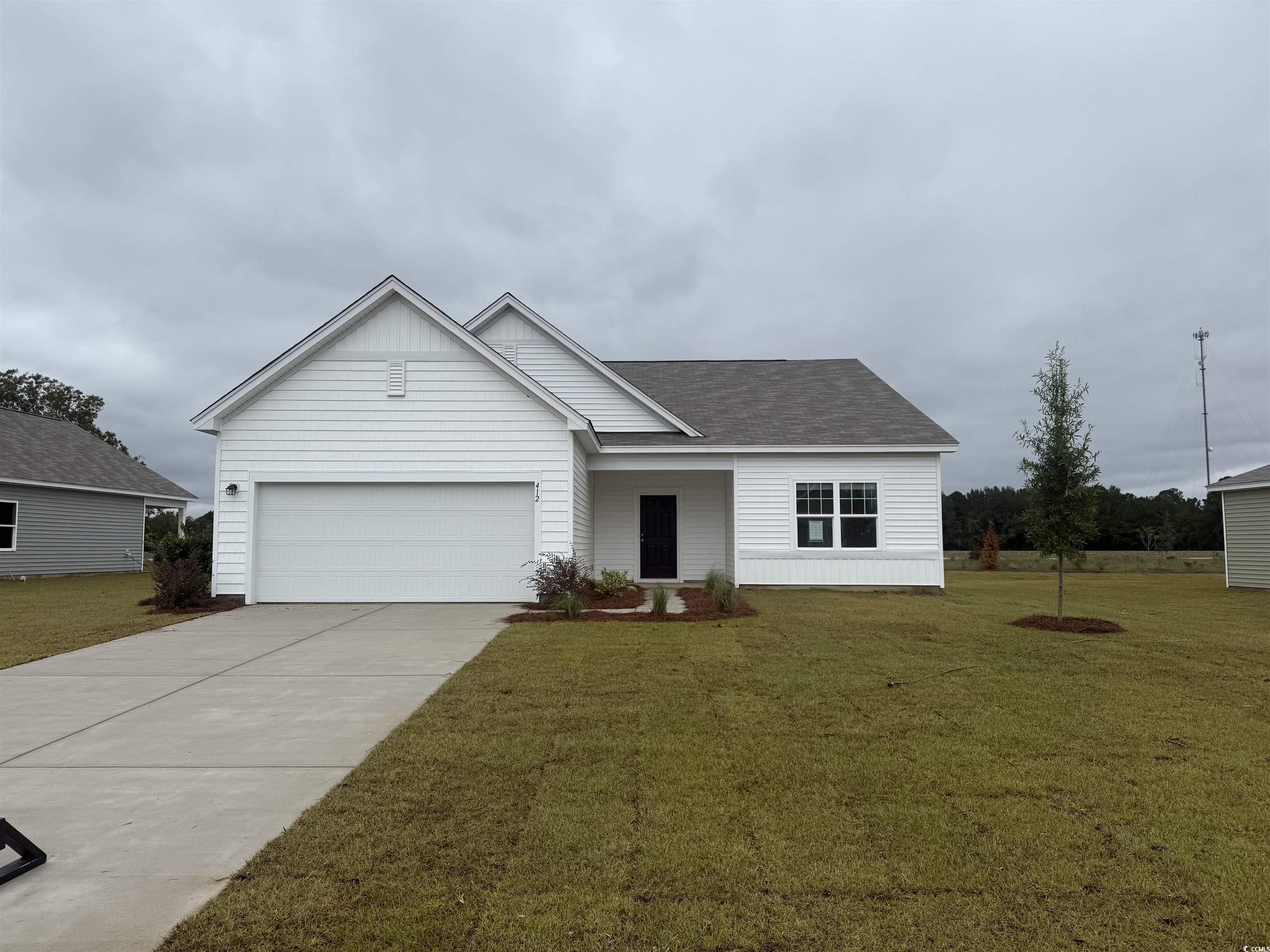 Single story home with concrete driveway, a shingled roof, a front lawn, a porch, and an attached garage