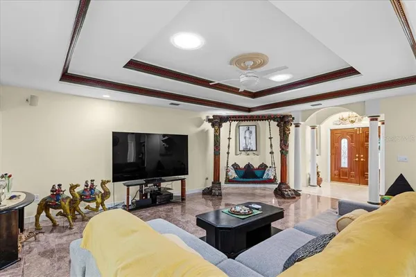 a living room with furniture and a flat screen tv