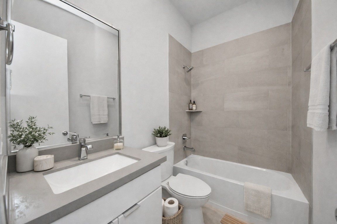 608 Thornton Road, Unit A Houston, TX 77018 - Photo 11 of 44 a bathroom with a sink a toilet and shower