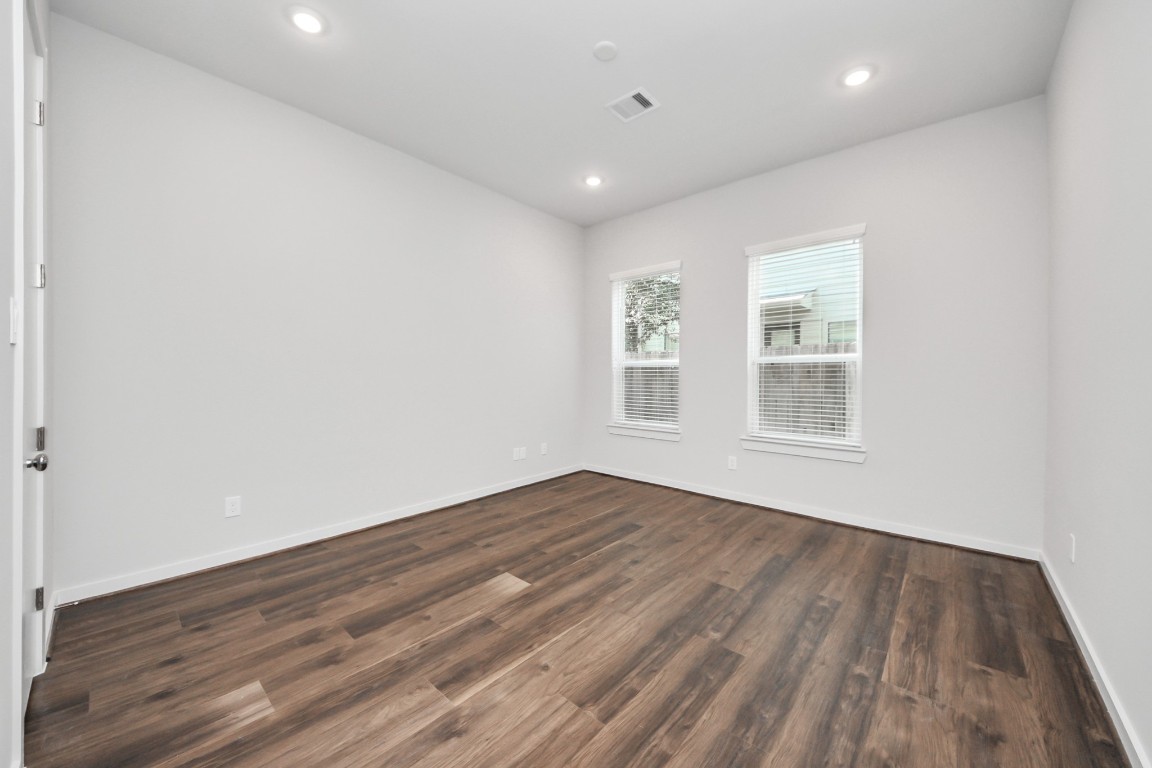 608 Thornton Road, Unit A Houston, TX 77018 - Photo 12 of 44 a view of empty room with wooden floor and fan