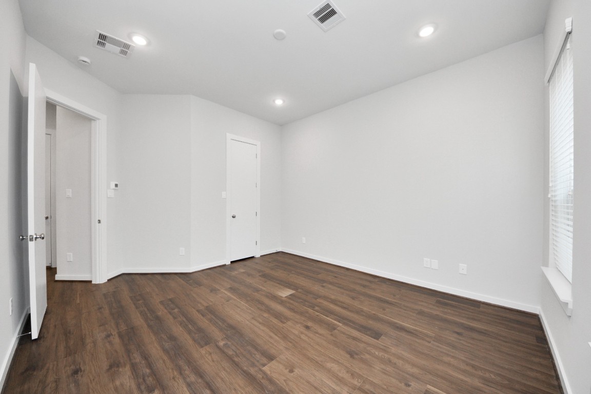 608 Thornton Road, Unit A Houston, TX 77018 - Photo 13 of 44 an empty room with wooden floor