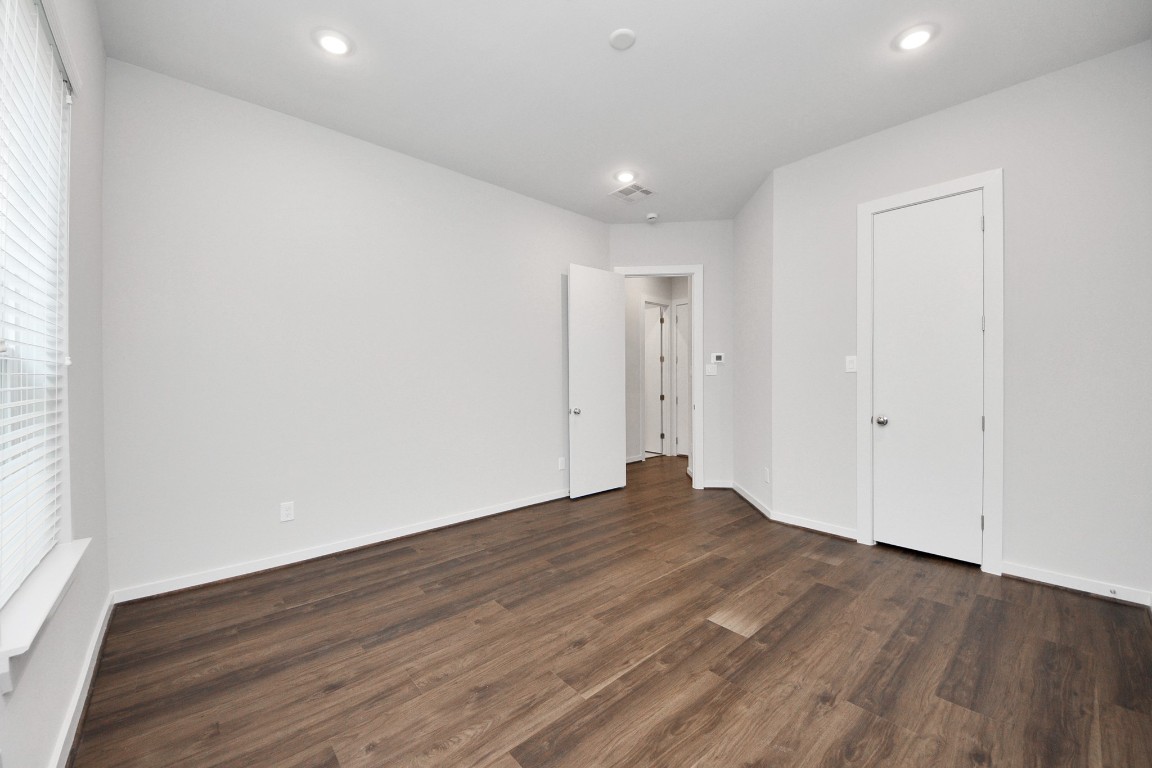 608 Thornton Road, Unit A Houston, TX 77018 - Photo 14 of 44 a view of empty room with wooden floor and fan