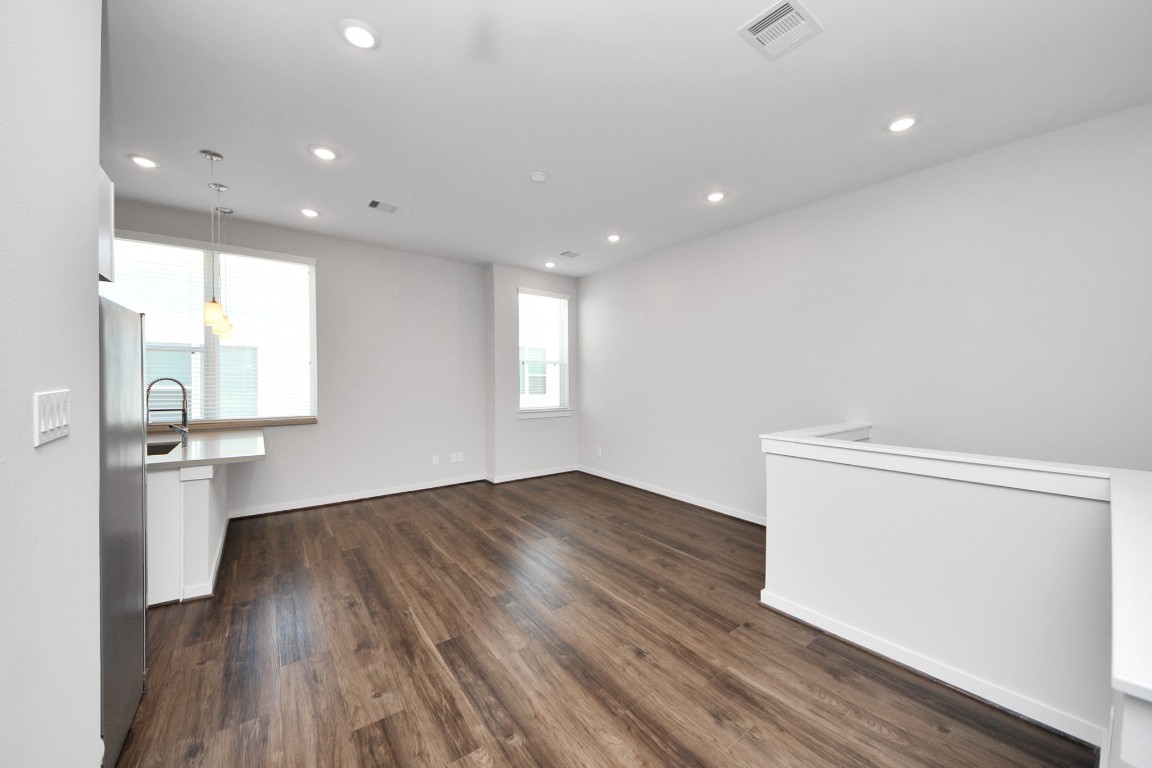 608 Thornton Road, Unit A Houston, TX 77018 - Photo 22 of 44 a view of empty room with wooden floor and fan