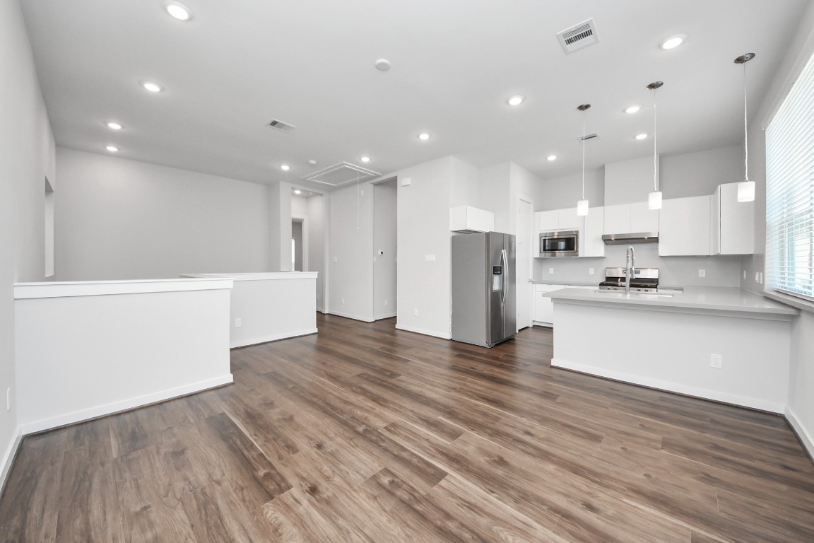608 Thornton Road, Unit A Houston, TX 77018 - Photo 24 of 44 a view of kitchen with kitchen island and stainless steel appliances