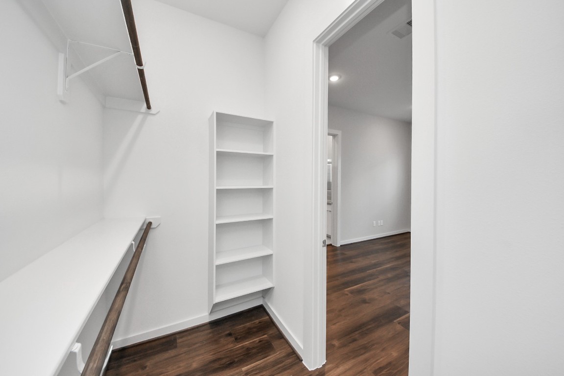 608 Thornton Road, Unit A Houston, TX 77018 - Photo 36 of 44 a view of walk in closet with empty racks