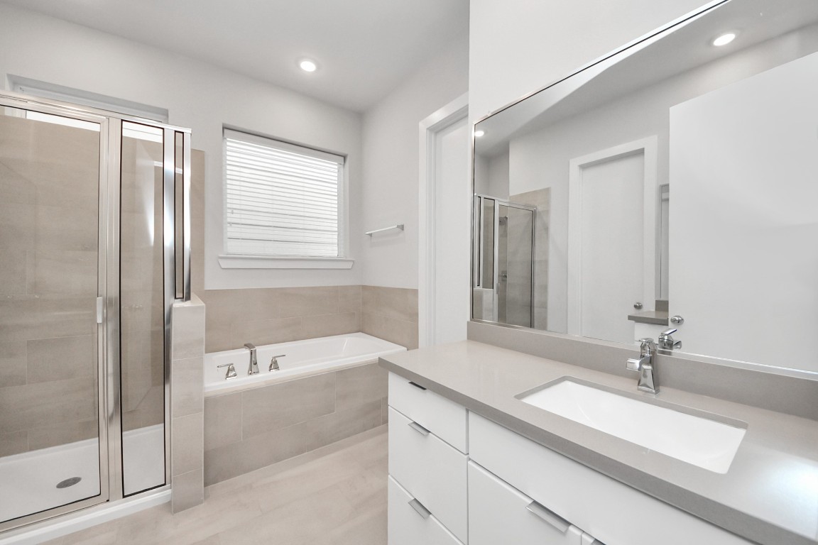 608 Thornton Road, Unit A Houston, TX 77018 - Photo 38 of 44 a bathroom with a tub sink and mirror