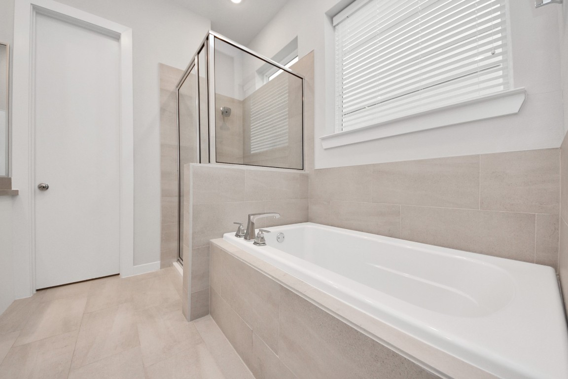 608 Thornton Road, Unit A Houston, TX 77018 - Photo 41 of 44 a bathroom with a bathtub and shower