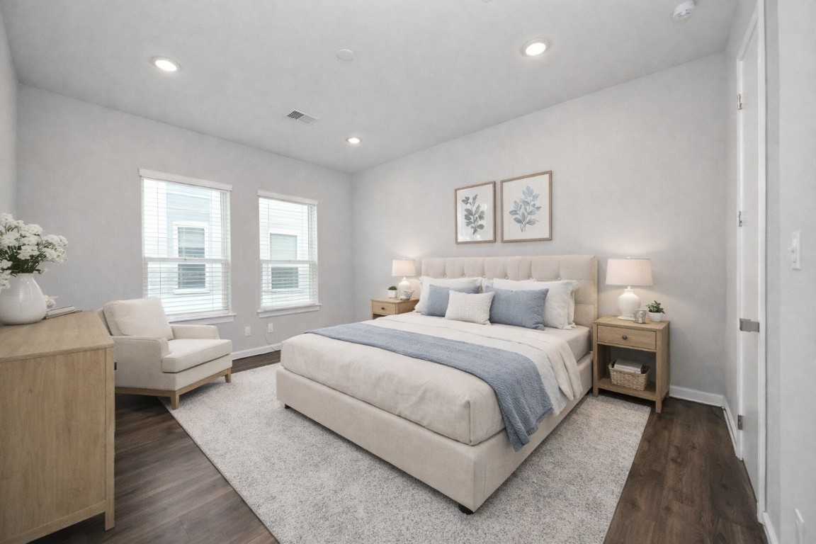 608 Thornton Road, Unit A Houston, TX 77018 - Photo 9 of 44 a spacious bedroom with a bed and a couch