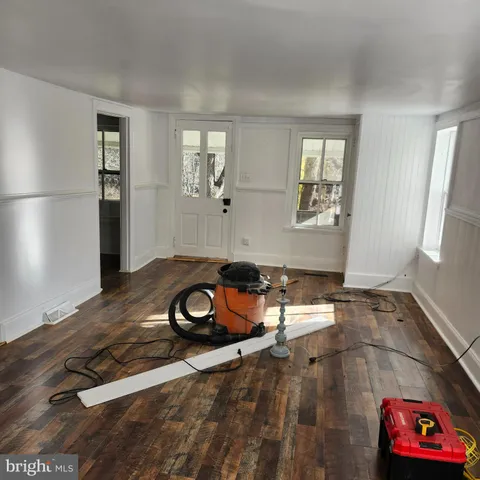 a view of an empty room with windows