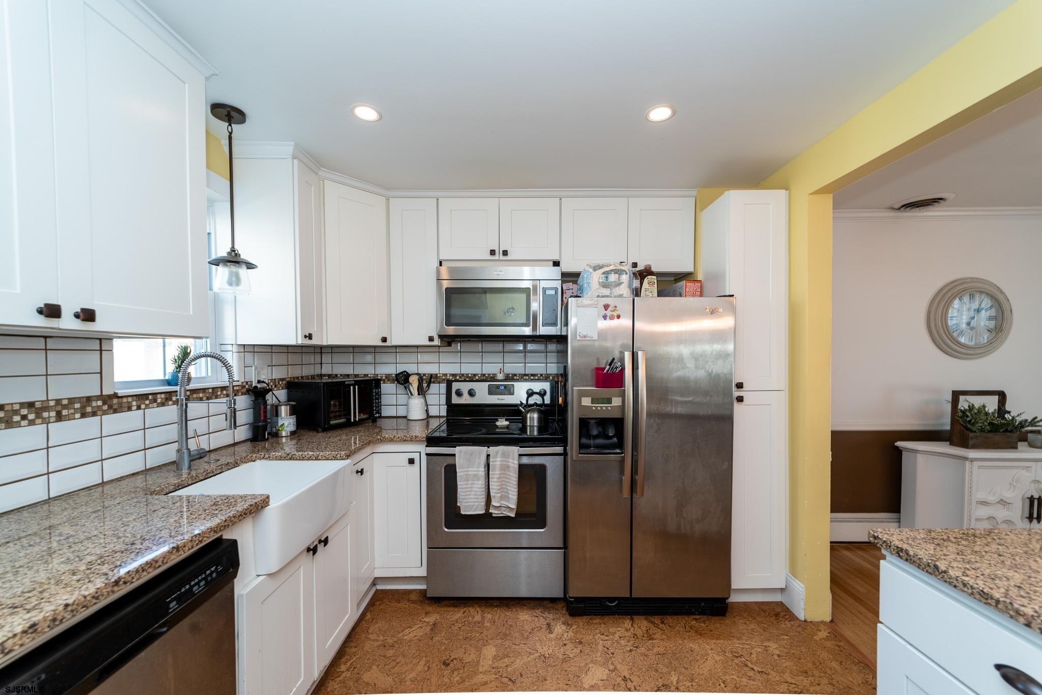 601 Amherst Road Audubon, NJ 08106 - Photo 14 of 30 a kitchen with stainless steel appliances granite countertop a refrigerator a stove and a sink