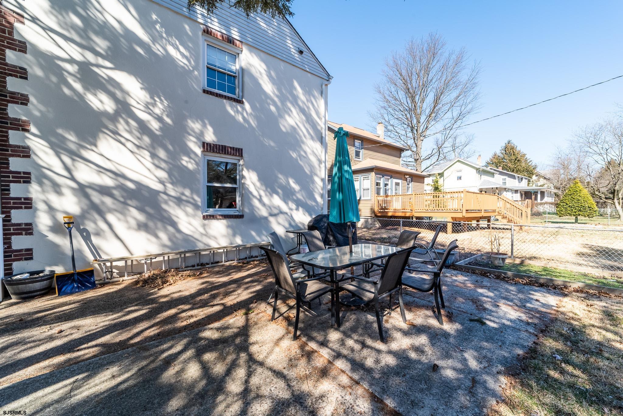 601 Amherst Road Audubon, NJ 08106 - Photo 28 of 30 a view of a patio with table and chairs with wooden floor and plants