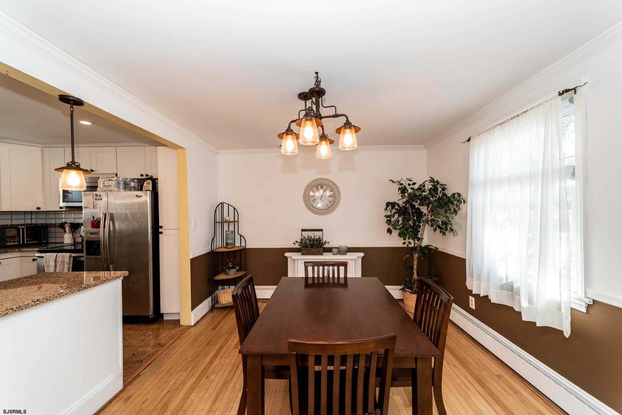 601 Amherst Road Audubon, NJ 08106 - Photo 8 of 30 a view of a dining room with furniture window and wooden floor