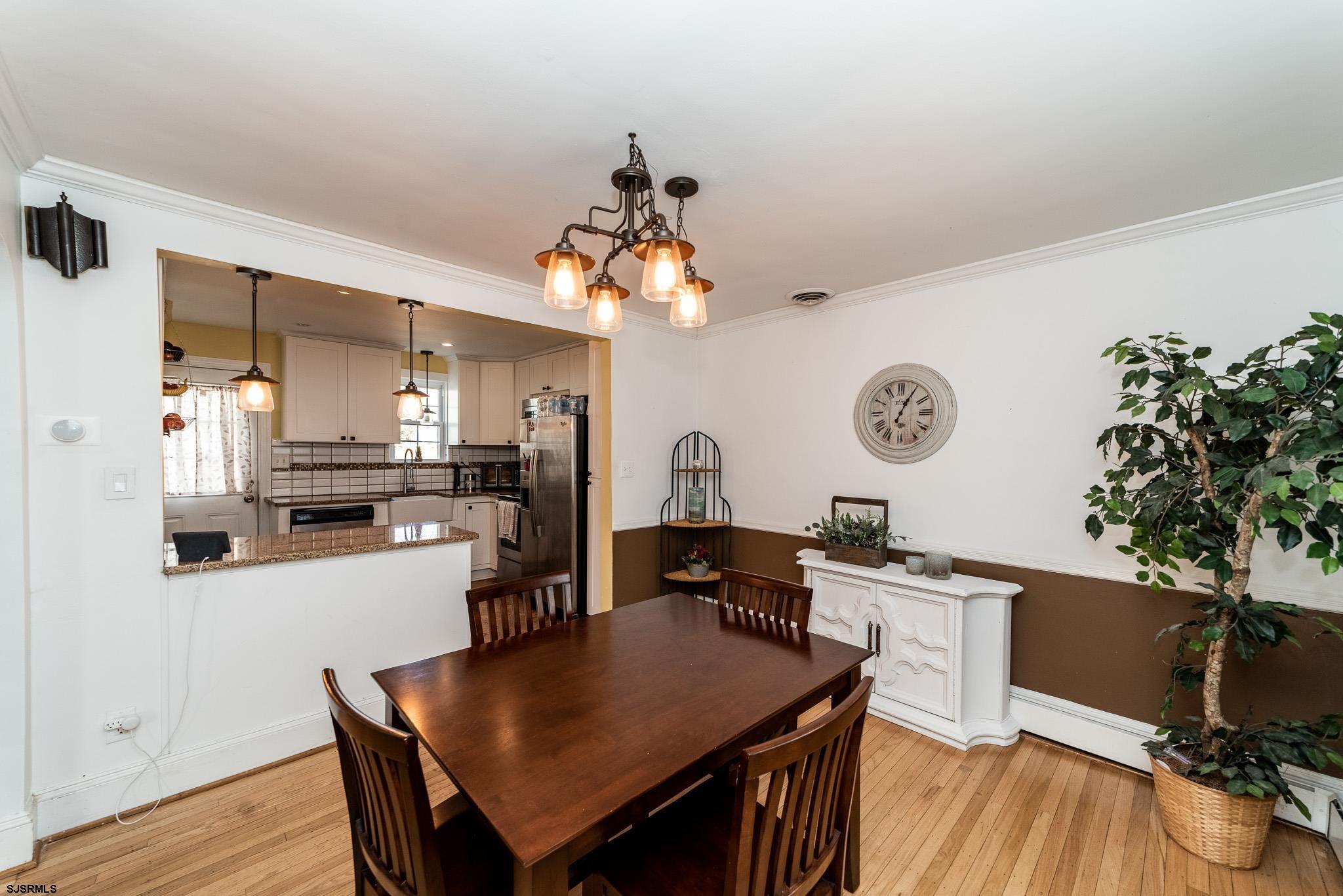 601 Amherst Road Audubon, NJ 08106 - Photo 9 of 30 a view of a dining room with furniture and wooden floor