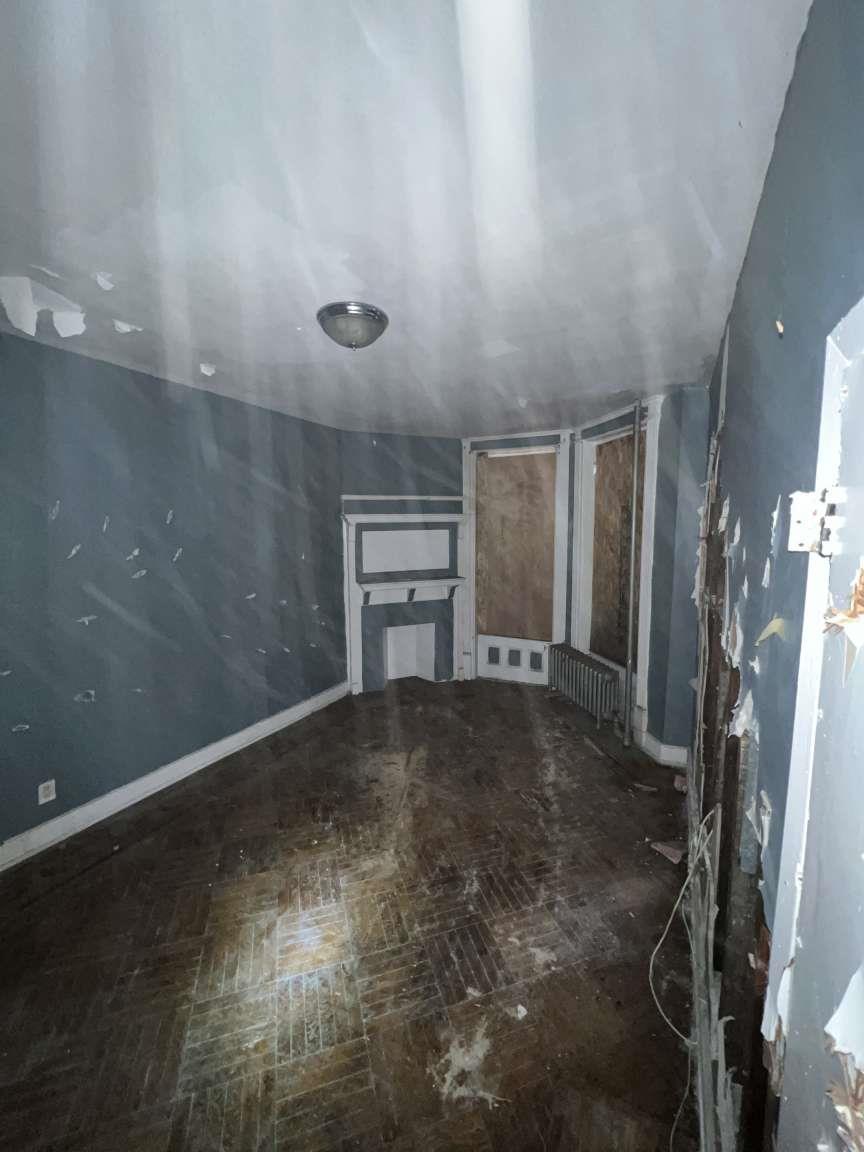 1430 Pacific Street Brooklyn, NY 11216 - Photo 14 of 24 Unfurnished living room with radiator heating unit