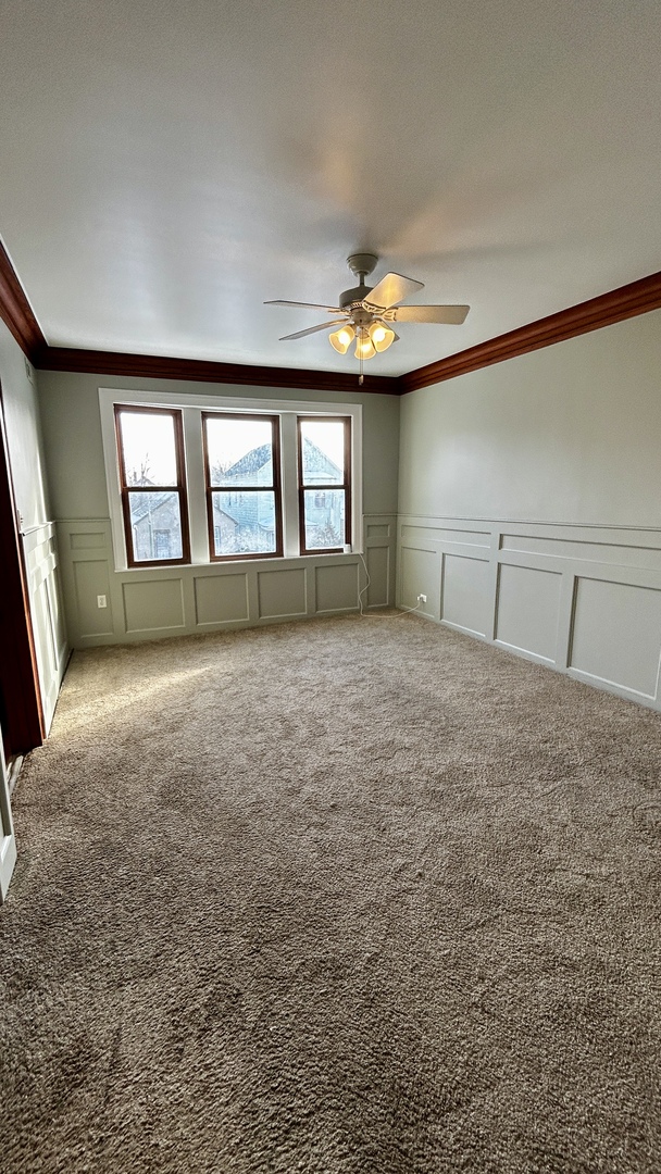 8406 South Brandon Avenue, Unit 2 Chicago, IL 60617 - Photo 3 of 9 a view of an empty room with a window