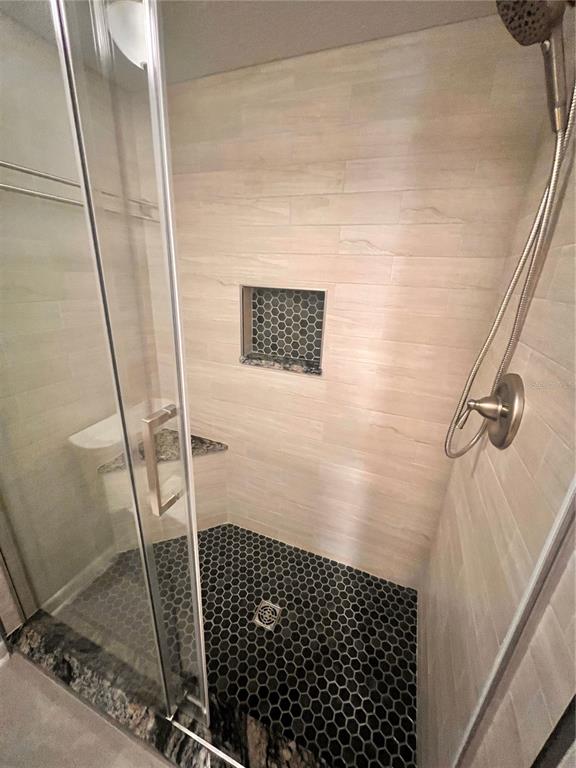 17 Escondido Circle, Unit 239 Altamonte Springs, FL 32701 - Photo 20 of 30 a bathroom with a shower