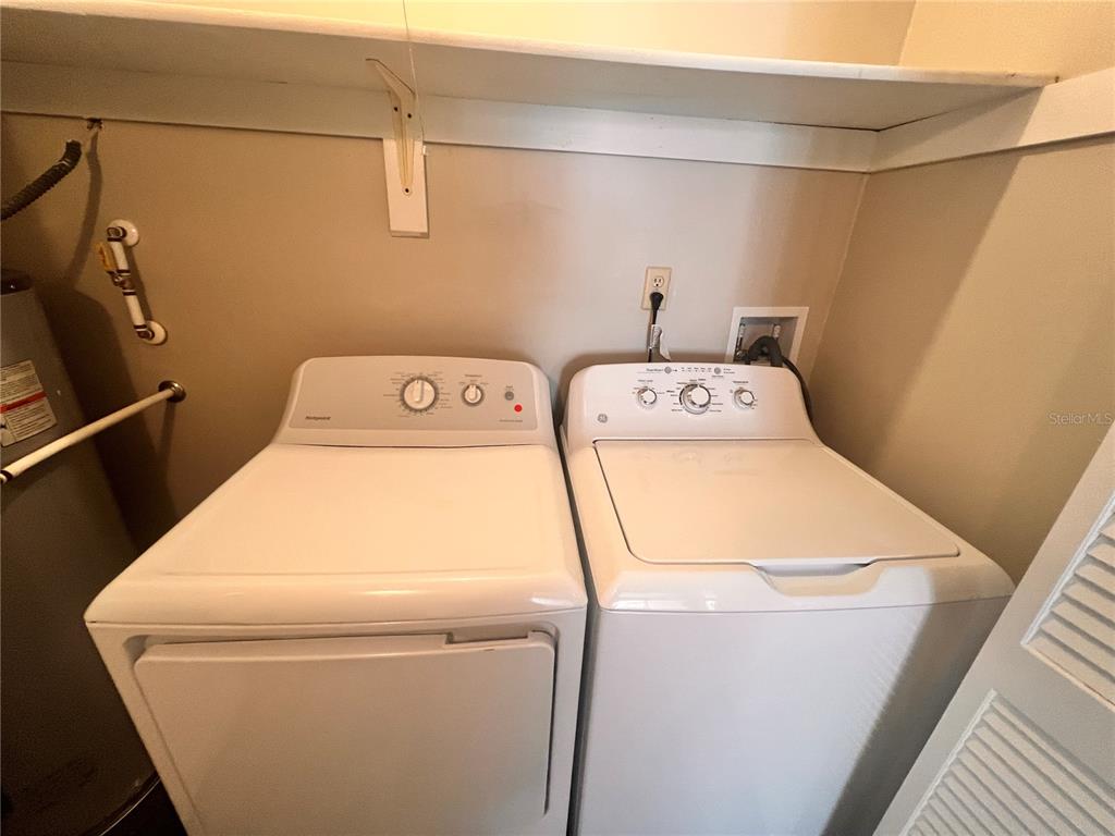 17 Escondido Circle, Unit 239 Altamonte Springs, FL 32701 - Photo 21 of 30 a utility room with dryer and washer