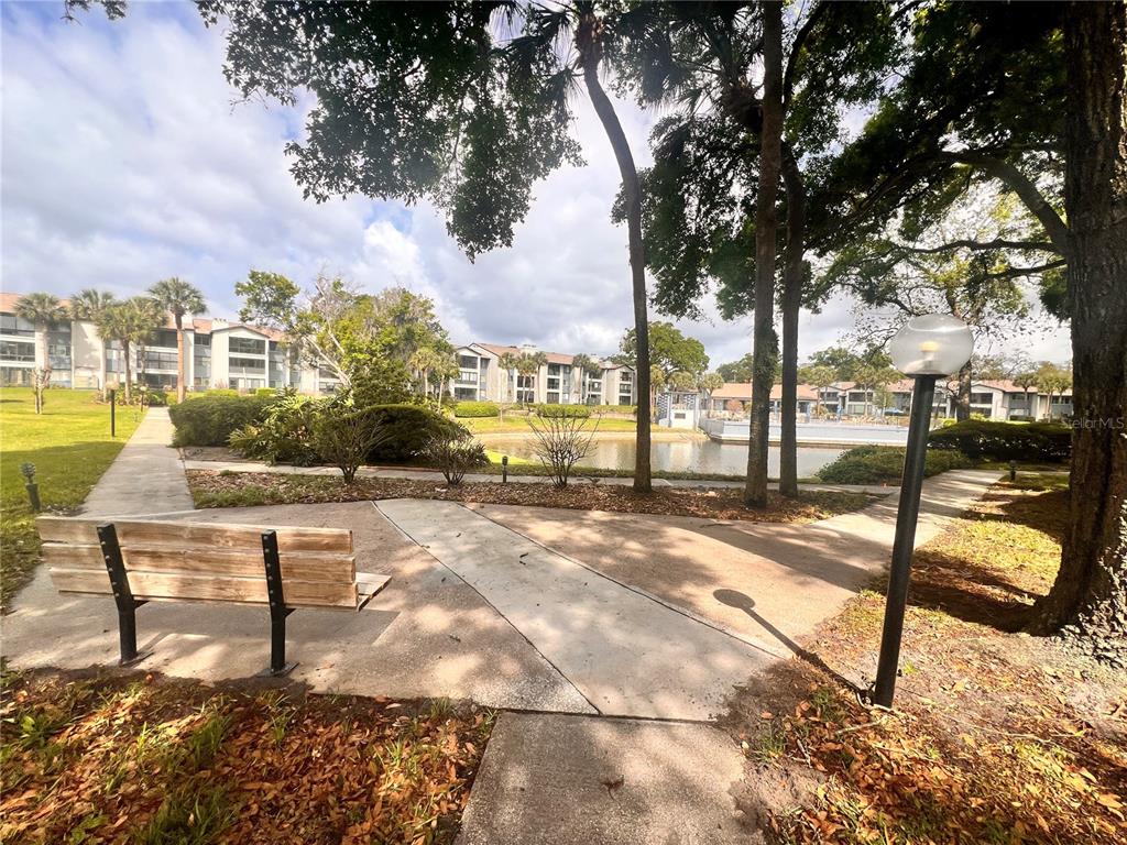 17 Escondido Circle, Unit 239 Altamonte Springs, FL 32701 - Photo 25 of 30 a view of a swimming pool with a patio