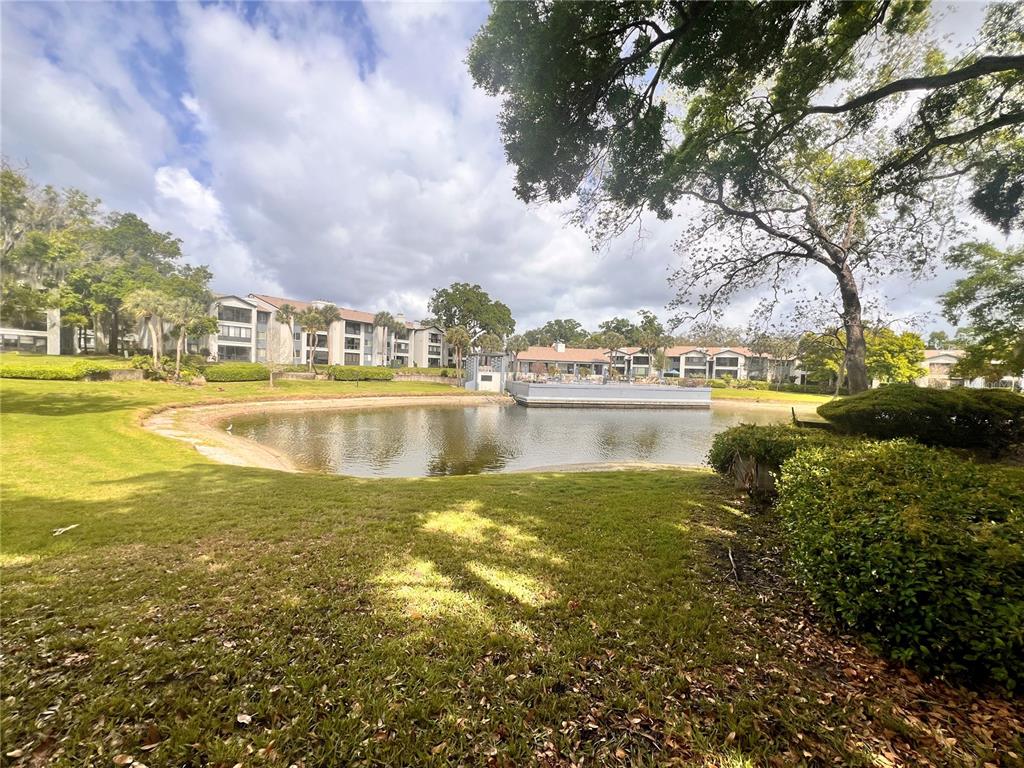 17 Escondido Circle, Unit 239 Altamonte Springs, FL 32701 - Photo 26 of 30 a view of a lake with houses in the back