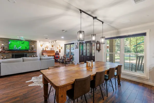 a kitchen with sink refrigerator and microwave