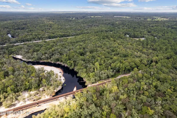 a view of a yard and mountain from a yard
